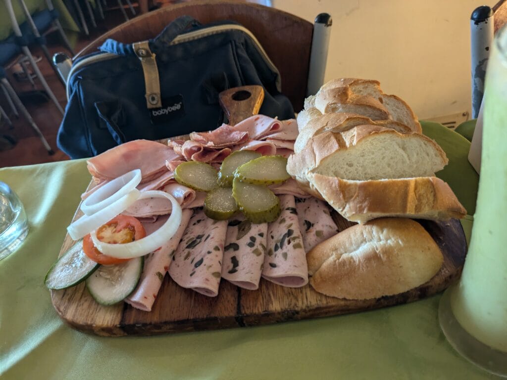 Cold Cuts Platter with bread and tomatoes, onions, and cucumber